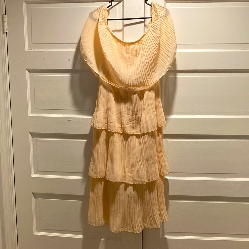 Peach colored dress. Never worn but tags removed.